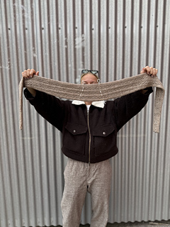Boomerang shape due to back neck shaping.