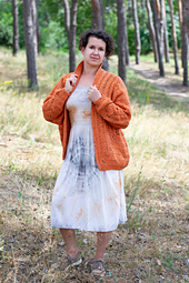 Cozy autumn crochet cardigan featuring a repeating striped pattern, perfect for layering in cooler weather.