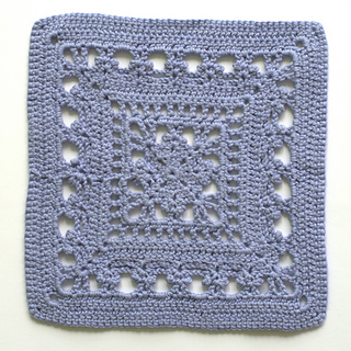 Wrong side of finished crochet pattern square in cotton yarn