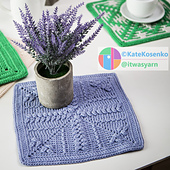 Sure! Here's a concise version with the focus on the crochet pattern:

﹥ A lavender crochet square displayed with flowers and a teacup in the background.
