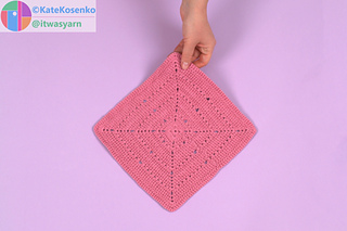 Wrong side of the textured crochet square with crossed double crochet stitches.