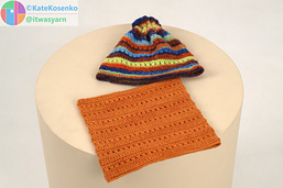Orange crochet cowl and striped hat with drawcord, handmade DK yarn accessories.
