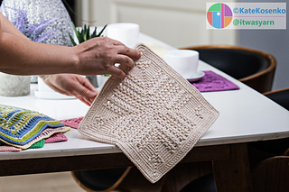 A beige crocheted square with a textured pattern, made with cotton yarn for practical use.