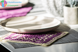 Textured crochet placemat made of light worsted yarn.