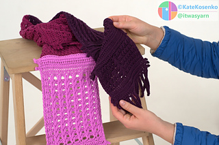 Hands presenting detailed crochet pattern