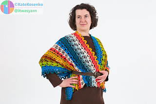 Woman wearing crochet shawl as belted wrap, half-turn view highlighting fit and styling