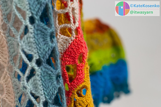 Close-up of airy lace crochet shawl pattern with delicate open stitches and soft drape