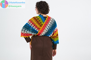 Crochet shawl styled with belt from behind, highlighting drape and modular design