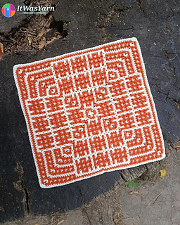 Ripple crochet square in cream and rust on a tree stump.