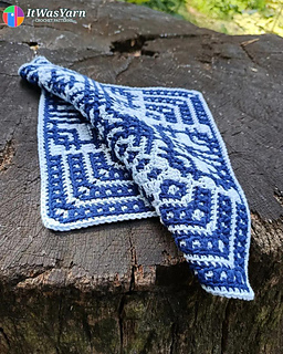 Orbit crochet square draped in soft waves.