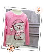 Side view of Snolene the snowman, a pink Christmas jumper knitting pattern for kids in Stylecraft Special DK