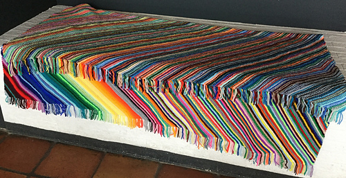 fringes trimmed!
folded so one can see both the front and back sides.