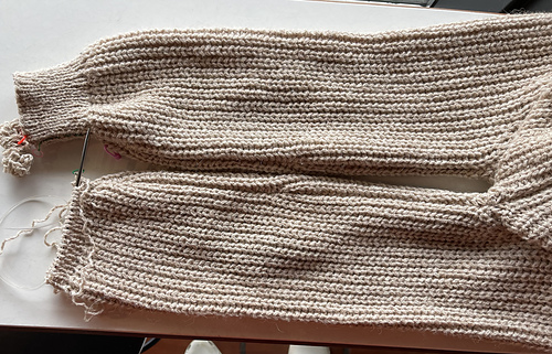 2023-12-31 armpits to cuffs - one finished and one in progress.
