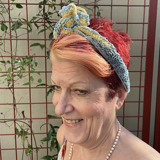 Jill wearing Porto Sun & Sky wrapped and knotted at the top of her head.
