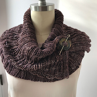 Worsted Combined in It Could Be Worsted, closed with a shawl pin.