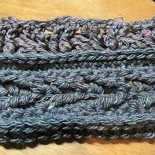 The yarn is soft, loosely spun, and tweedy