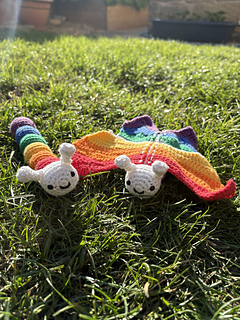 Roy and Biv outside together on the grass.