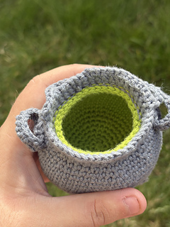 Green inside of empty cauldron.