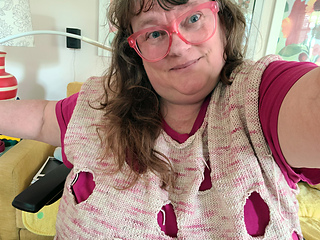 definitely meant to be worn over a bright pink tee!