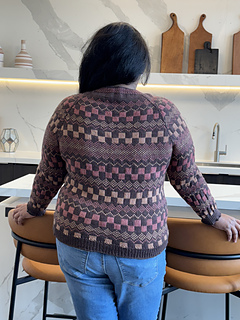 I am wearing a size 5, knit with 0" of ease and tapered sleeves