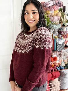 Shreya is wearing a size 4 sweater