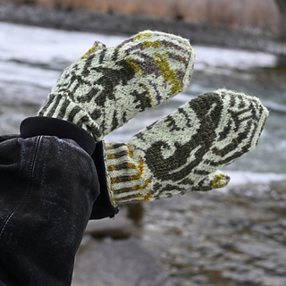 Green Gemini mittens by the docks