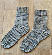 As with all variegated yarn, it looks much nicer IRL than it does in photograph. The nuance is lost here.