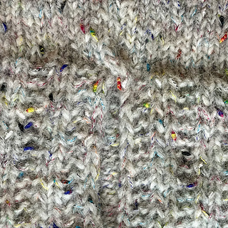 I worked a 4 stitch cable twist right before the split to reinforce it. It is firm and I think it looks cute!