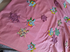 Being stitched onto cloth
