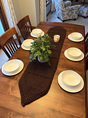 Her table is 4” longer, so a place setting would
work at at least one end.  This is unblocked