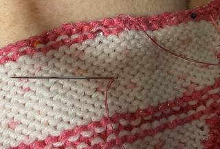 Sewing last two rows together on the back side to mitigate rolling. 