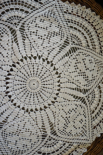 On a glass side table.