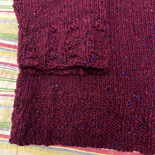 Cuff detail featuring an irregular ribbing that is supposed to mimic Irish seaweed (carrageenan moss)