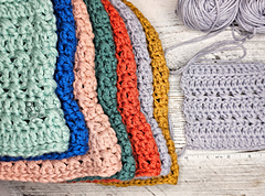 Crossed Stitch Bucket Hat in 7 Sizes Next to Gauge Swatch