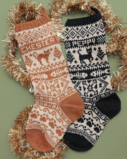 Sam customized her cat stockings using a DK weight yarn, 3.5mm (US 4) needles, and a mix of charts from various sources.