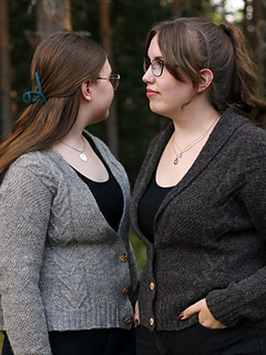 Cable B and narrow buttonband on left, Cable A and shawl collar on the right.