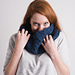 [Image Description: A woman wearing a dark blue worsted/aran weight cowl]