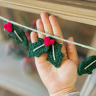 finished holly motif measures about 3in x 3in