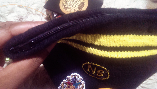 Finished with a zipper. The Hufflepuff House Robe Patch is from Universal Studios about 6 years ago. The initials patch came from the lovely 'Malena's Patches' on eBay. The 'Hogwarts Knitting Club' merch is from the talented Dominika at 'Auberginen Art' on Etsy.