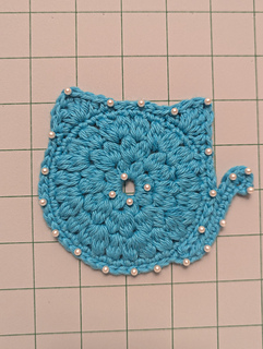 Pinned with pearlescent pins to block but also to give an idea of beads added to end product.