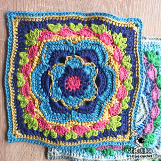 Finished Bold Buttercup flower large granny square showing layered petals, raised texture, and clean square corners. Perfect for blankets, cushions, or floral crochet projects.
