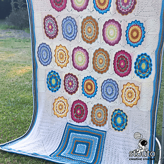The Flower Pot Crochet Blanket is a large granny square patchwork blanket made from 12 unique crochet squares