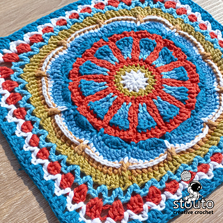 Close-up of the TMBJGF Flower Granny Square showing raised flower petal stitch detail