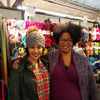 Shop minion Alicia models the hat.  We fan-girled over Karida, the founder of Neighborhood Fiber Co.