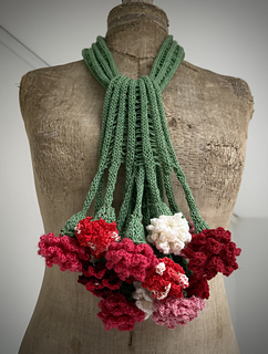 This is a 7 'stem' scarf with 1 dropped stitch between stems.