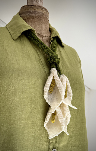 With just 4 flowers (2 on each end). You could even knit this up with 2 total flowers!