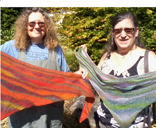 Two students with their finished shawls.