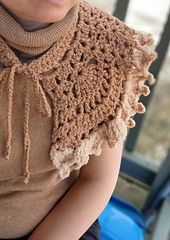 Handmade Bertha Collar crochet pattern shown as a vintage statement piece on a simple blouse.