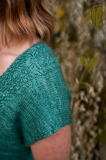 sample is shown in size 42” with 9” of positive ease