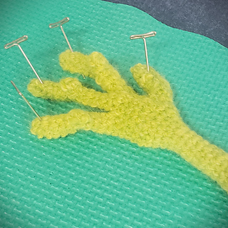 I'm pretty certain this is the most difficult thing I have ever crocheted. In part it is because I am unaccustomed to the unusual pattern writing style, and also because those fingers are worked in very tight rounds and doing several unusual things at once. Knuckles!